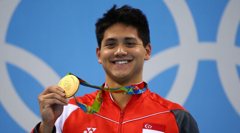 Joseph Schooling of Singapore celebrates winning the gold medal in the Men's 100m Butterfly Final on Day 7 of the Rio 2016 Olympic Games at the Olympic Aquatics Stadium on August 12, 2016 in Rio de Janeiro, Brazil. (Photo by Clive Rose/Getty Images)