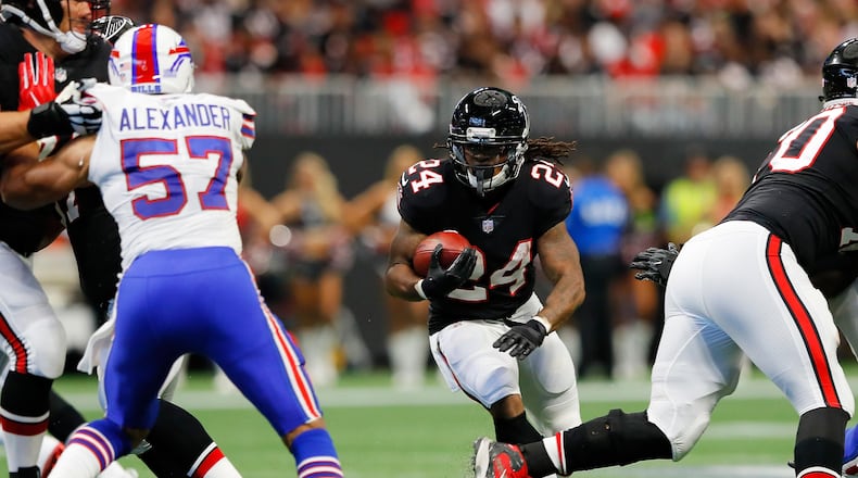 ATLANTA, GA - OCTOBER 01: Devonta Freeman #24 of the Atlanta Falcons runs the ball during the first half against the Buffalo Bills at Mercedes-Benz Stadium on October 1, 2017 in Atlanta, Georgia. (Photo by Kevin C. Cox/Getty Images)