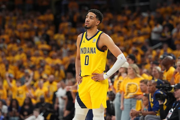 Indiana Pacers guard Tyrese Haliburton watches during the second half of Game 4 of the NBA Finals basketball series against the Oklahoma City Thunder, Friday, June 13, 2025, in Indianapolis. (AP Photo/Michael Conroy)