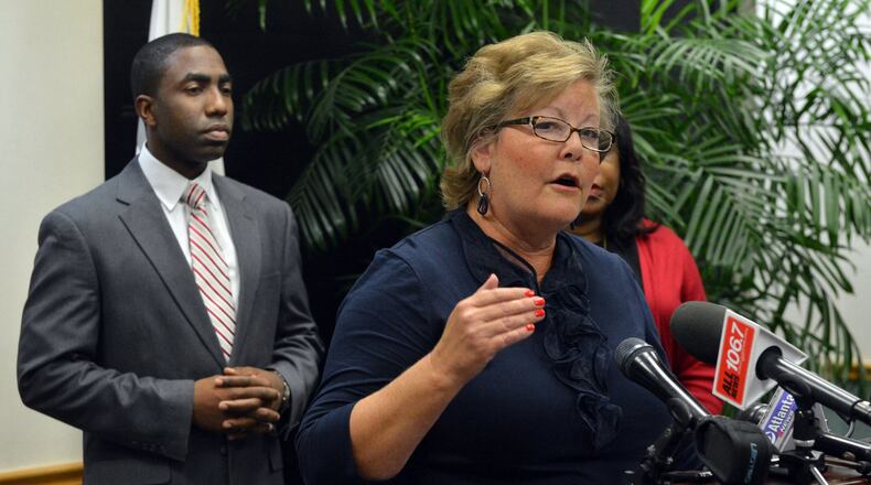From 2013: Commissioner Elaine Boyer speaks during a press conference held by Interim DeKalb CEO Lee May (left) and DeKalb commissioners and how they plan to respond to the Grand Jury report. The findings of a year-long investigation into allegations of bid rigging and kickbacks in DeKalb County contracts, made public for the first time late Wednesday, allege a culture of corruption that spans two administrations and runs from the top job in Georgia’s third-largest county down to workers and contractors in the watershed department.