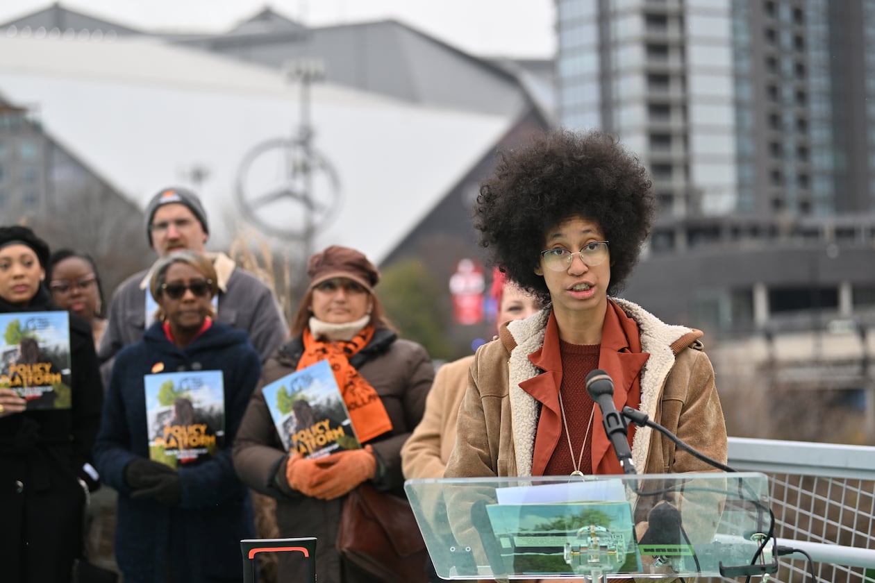Mariah Parker, steering committee at Play Fair ATL, speaks to members of the media during an event to launch its policy platform outlining community-driven demands ahead of the 2026 FIFA World Cup on the Steele Bridge near the Mercedes-Benz Stadium, Thursday, December 4, 2025, in Atlanta. (Hyosub Shin/AJC)