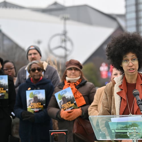 Mariah Parker, steering committee at Play Fair ATL, speaks to members of the media during an event to launch its policy platform outlining community-driven demands ahead of the 2026 FIFA World Cup on the Steele Bridge near the Mercedes-Benz Stadium, Thursday, December 4, 2025, in Atlanta. (Hyosub Shin/AJC)