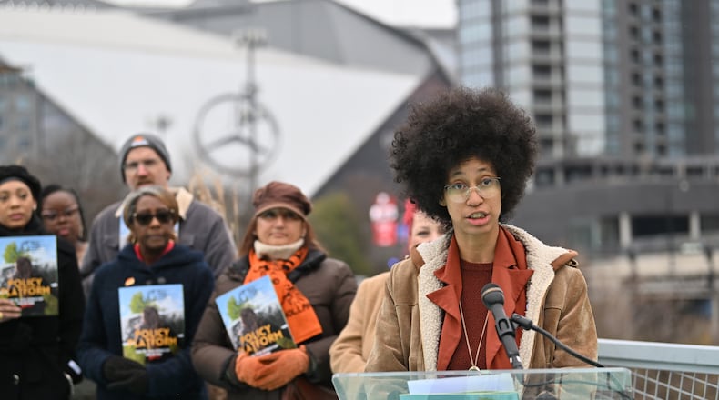 Mariah Parker, steering committee at Play Fair ATL, speaks to members of the media during an event to launch its policy platform outlining community-driven demands ahead of the 2026 FIFA World Cup on the Steele Bridge near the Mercedes-Benz Stadium, Thursday, December 4, 2025, in Atlanta. (Hyosub Shin/AJC)