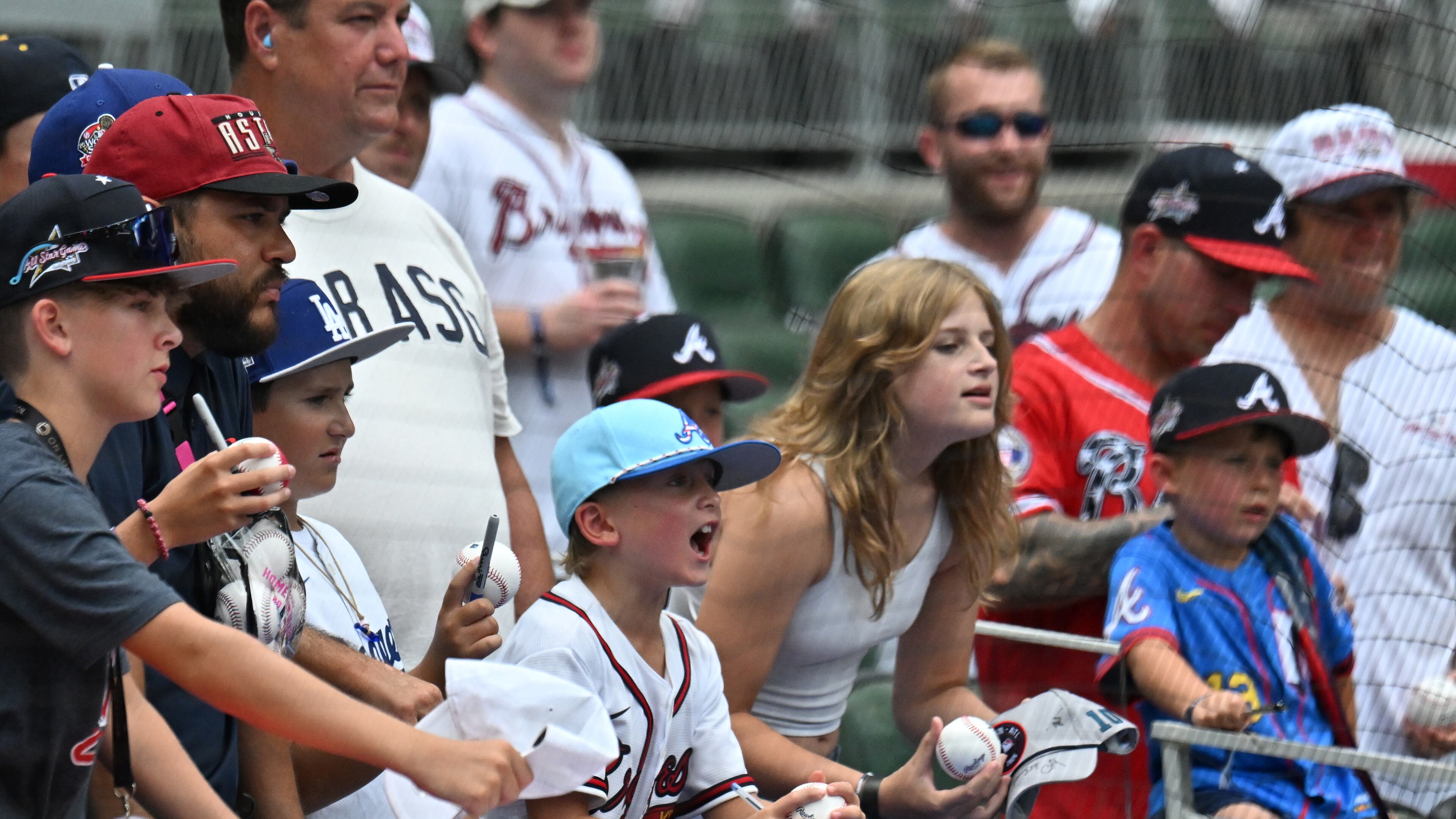 Baseball fans ask for autographs before the 2025 MLB All-Star Game at Truist Park, Tuesday, July 15, 2025, in Atlanta. (Hyosub Shin/AJC)