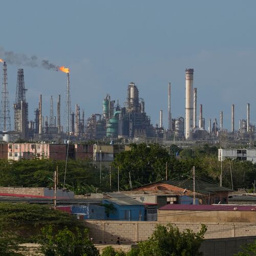Flames rise from flare stacks at the Amuay refinery in Los Taques, Venezuela, Wednesday, Jan. 14, 2026. (AP Photo/Matias Delacroix)