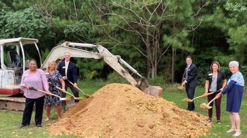 From left are: Snellville Councilmembers Solange Destang, Cristy Lenski and Tod Warner, Mayor Pro Tem Dave Emanuel, Mayor Barbara Bender and Councilwoman Gretchen Schulz at groundbreaking for the new Greenway Trail. (Courtesy City of Snellville)