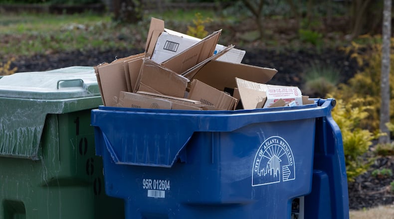 A city of Atlanta recycling bin full of cardboard awaits pickup in Ormewood Park in 2019. CONTRIBUTED BY PHIL SKINNER
