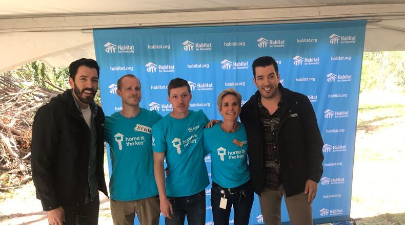 Drew (left) and Jonathan (right) Scott worked on a Habitat for Humanity build in Atlanta Thursday.