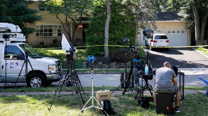 FILE - News media is set up in front of the home of U.S. District Judge Esther Salas in North Brunswick, N.J., on Monday, July 20, 2020, after a gunman posing as a delivery person shot and killed Salas' 20-year-old son and wounded her husband Sunday evening. (AP Photo/Mark Lennihan, File)