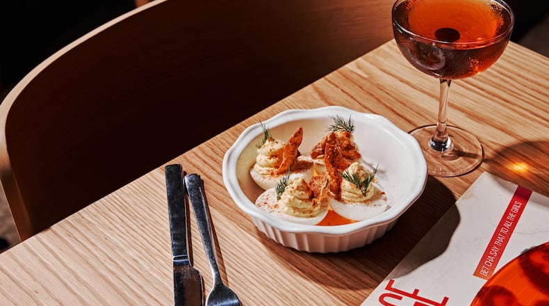 A-Town deviled eggs at Marcus Bar & Grille are seasoned with cayenne pepper and hot sauce and have a bit of crackly fried chicken skin added on top. (Courtesy of Marcus Bar & Grille)