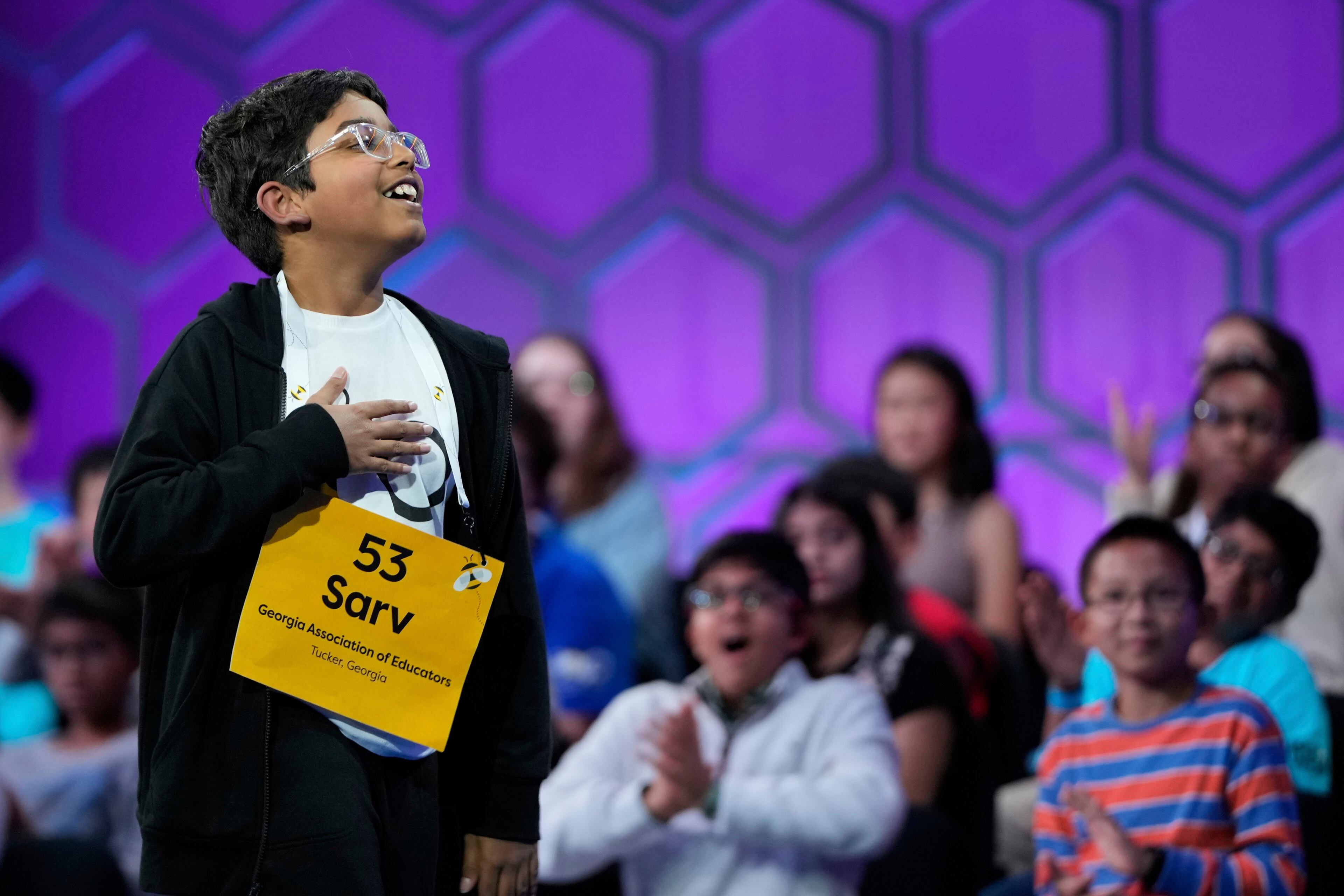 Sarv Dharavane, 11, of Tucker, Ga., reacts after spelling his word correctly in the finals of the Scripps National Spelling Bee, Thursday, May 29, 2025, in Oxon Hill, Md. (AP Photo/Julia Demaree Nikhinson)