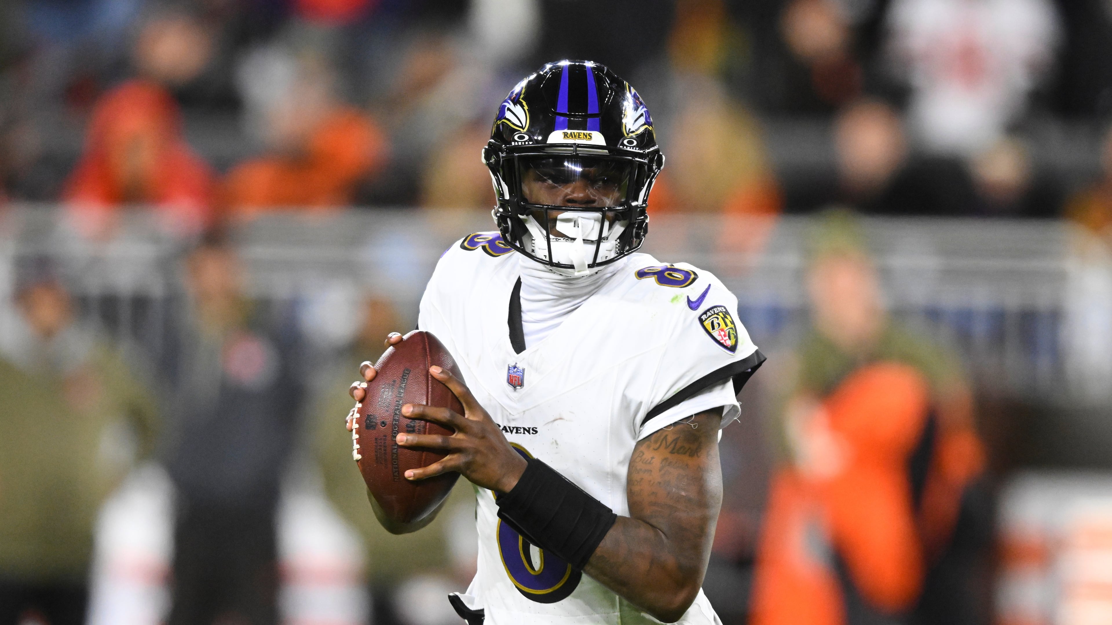Baltimore Ravens quarterback Lamar Jackson (8) rolls out of the pocket in the second half of an NFL football game against the Cleveland Browns in Cleveland, Sunday, Nov. 16, 2025. (AP Photo/David Richard)
