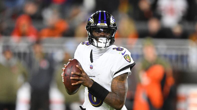 Baltimore Ravens quarterback Lamar Jackson (8) rolls out of the pocket in the second half of an NFL football game against the Cleveland Browns in Cleveland, Sunday, Nov. 16, 2025. (AP Photo/David Richard)