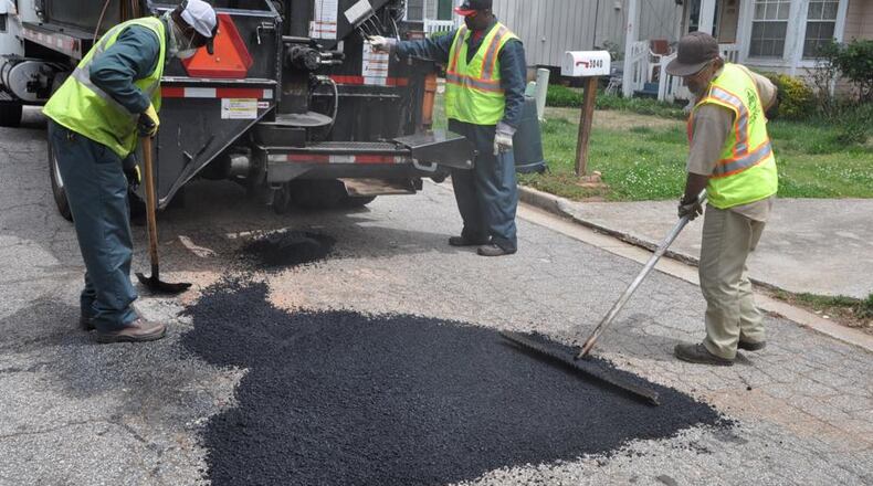 Totaling $1,766,816, two contracts were awarded June 4 by the Powder Springs City Council for road resurfacing. AJC file photo