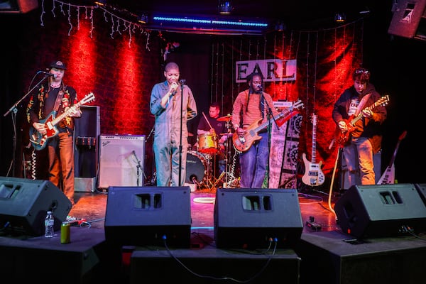 From left, guitarist Mikey Durham, vocalist KT Thompson, drummer Chris Salado (background), bassist Ausar Ward and guitarist Hoff of the punk band Upchuck perform during a sound check at the EARL in Atlanta on Wednesday, Dec. 31, 2025. (Abbey Cutrer/AJC)