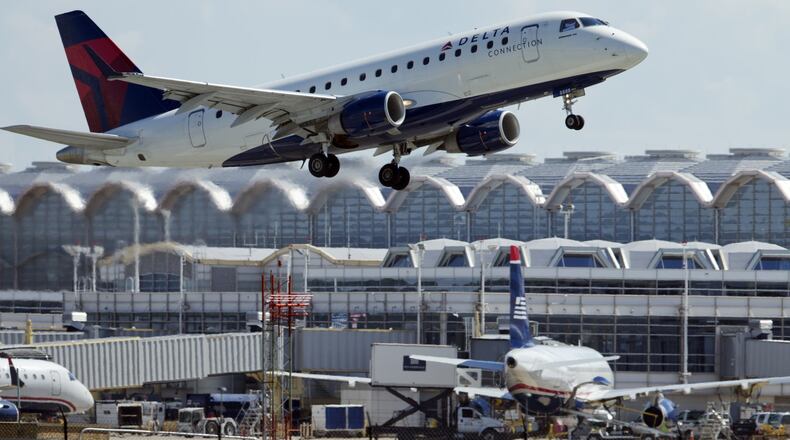 In this July 28, 2014, file photo, a Delta Air Lines jet takes off from Ronald Reagan Washington National Airport in Arlington, Va. (AP Photo/Manuel Balce Ceneta, File)