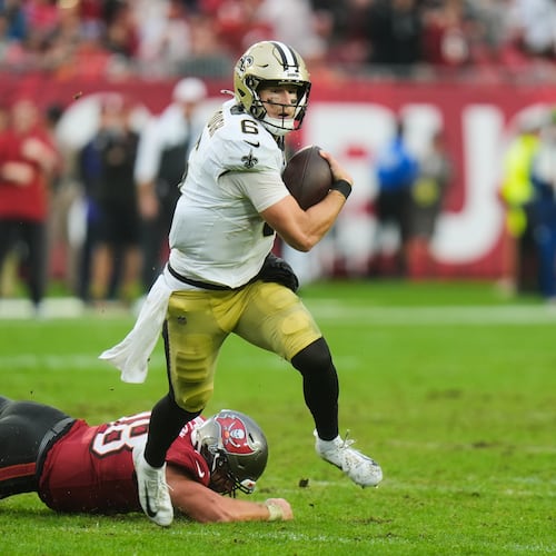 New Orleans Saints quarterback Tyler Shough (6) carries for a touchdown past Tampa Bay Buccaneers safety Rashad Wisdom (38) in the second half of an NFL football game, Sunday, Dec. 7, 2025, in Tampa, Fla. (AP Photo/Chris O'Meara)