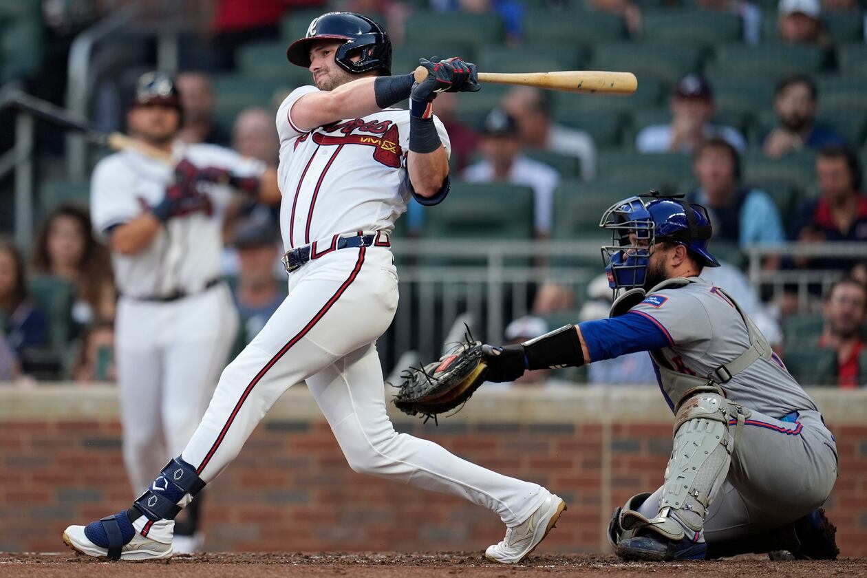 Atlanta Braves' Lane Thomas (20) hits a solo homerun against the New York Mets in the second inning of a baseball game, Wednesday, Aug. 12, 2026, in Atlanta. (AP Photo/Mike Stewart)