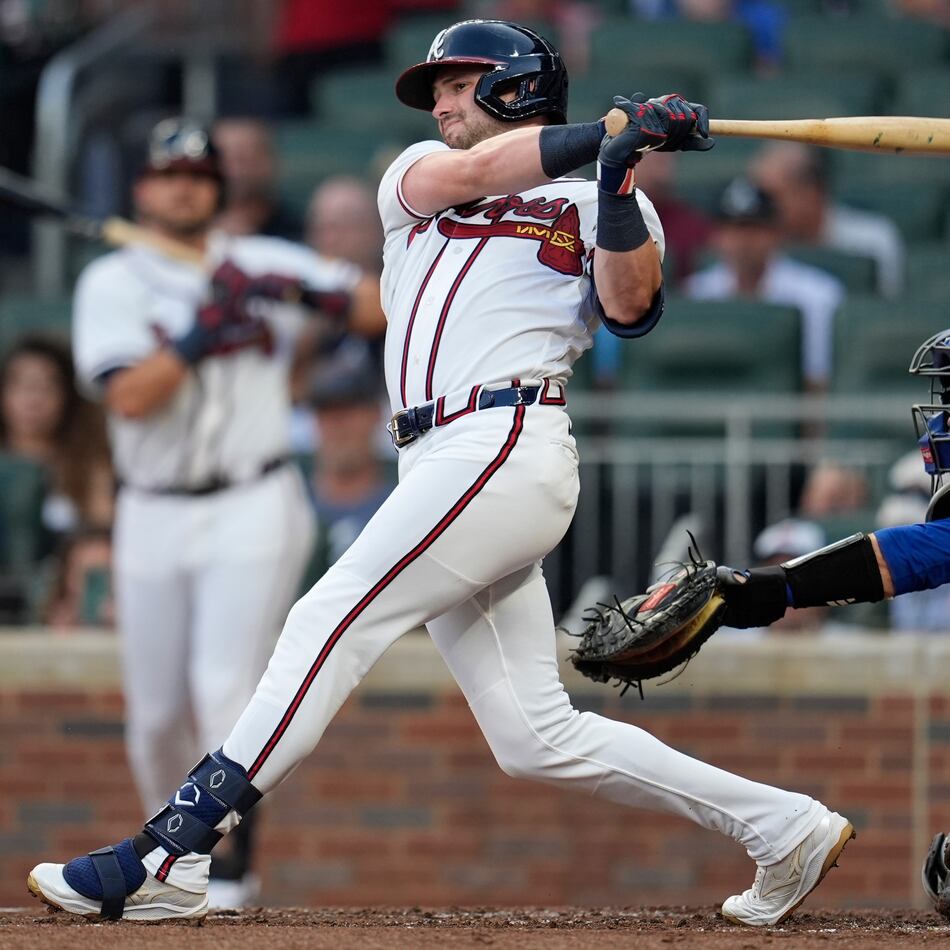 Atlanta Braves' Lane Thomas (20) hits a solo homerun against the New York Mets in the second inning of a baseball game, Wednesday, Aug. 12, 2026, in Atlanta. (AP Photo/Mike Stewart)