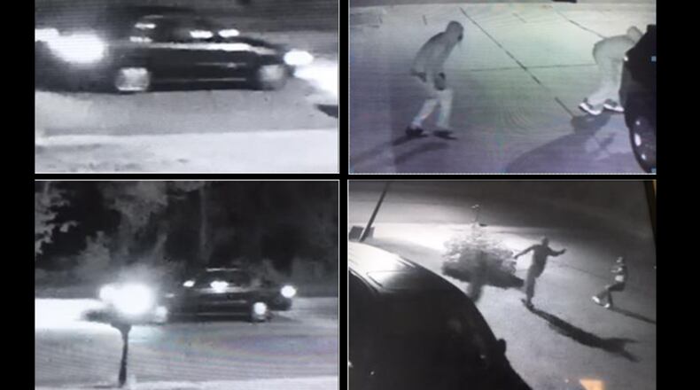 Gwinnett County police are searching for two men who robbed a victim at gunpoint steps away from his house.