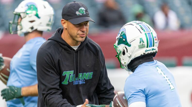 Tulane head coach Jon Sumrall, front left, talks to players before an NCAA college football game against Temple, Saturday, Nov. 22, 2025, in Philadelphia. (AP Photo/Laurence Kesterson)