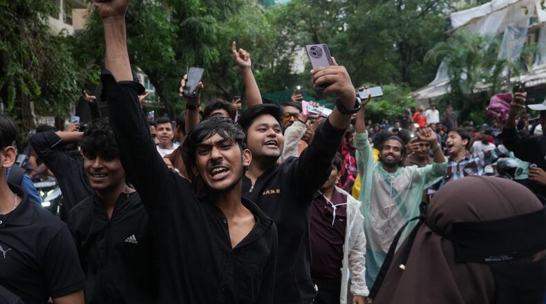 Protesters shout slogans during a demonstration demanding educational reforms as part of the Cockroach Janta Party's ongoing protest movement in Mumbai, India, Thursday, July 23, 2026. (AP Photo/Rafiq Maqbool)
