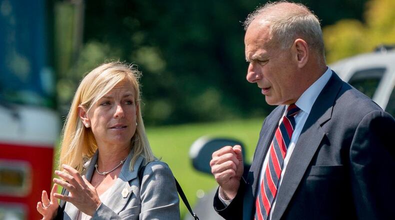 In this Aug. 22, 2017 photo, White House Chief of Staff John Kelly and Deputy Chief of Staff Kirstjen Nielsen speak together as they walk across the South Lawn of the White House in Washington. President Donald Trump nominated Kirstjen Nielsen as his next Secretary of Homeland Security. Nielsen was former DHS Secretary John Kellyâs deputy when he served in that role and moved with Kelly to the White House when he was tapped to be Trumpâs chief of staff. (AP Photo/Andrew Harnik)