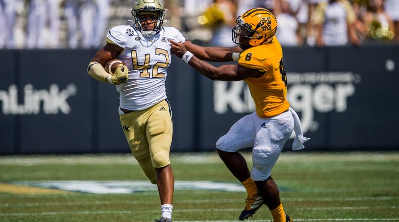 Georgia Tech defensive end Jordan Domineck wards off Kennesaw State quarterback Xavier Shepherd on a 70-yard fumble return for a touchdown in the Yellow Jackets' 45-17 win over the Owls September 11, 2021 at Bobby Dodd Stadium. (Danny Karnik/Georgia Tech Athletics)