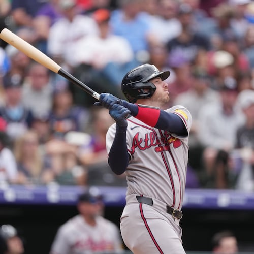 Atlanta Braves' Jonah Heim follows the flight of his sacrifice fly to drive in a run off Colorado Rockies relief pitcher Antonio Senzatela in the fifth inning of a baseball game, Sunday, May 3, 2026, in Denver. (AP Photo/David Zalubowski)