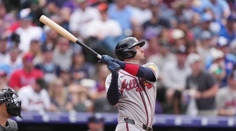 Atlanta Braves' Jonah Heim follows the flight of his sacrifice fly to drive in a run off Colorado Rockies relief pitcher Antonio Senzatela in the fifth inning of a baseball game, Sunday, May 3, 2026, in Denver. (AP Photo/David Zalubowski)