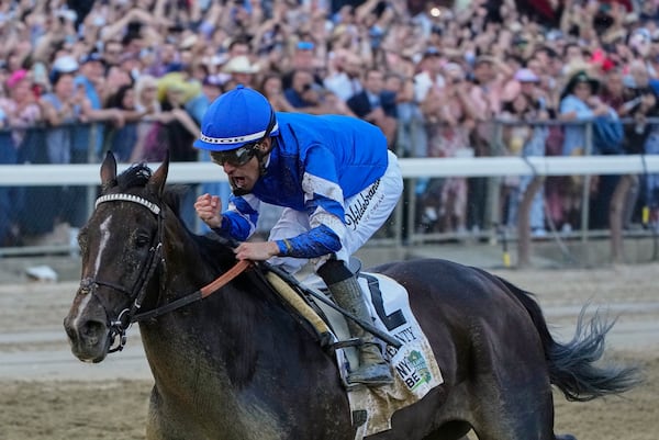 Jockey Junior Alvarado reacts aboard Sovereignty (2), as he crosses the finish line to win the 157th running of the Belmont Stakes horse race, Saturday, June 7, 2025, in Saratoga Springs, N.Y. (AP Photo/Seth Wenig)