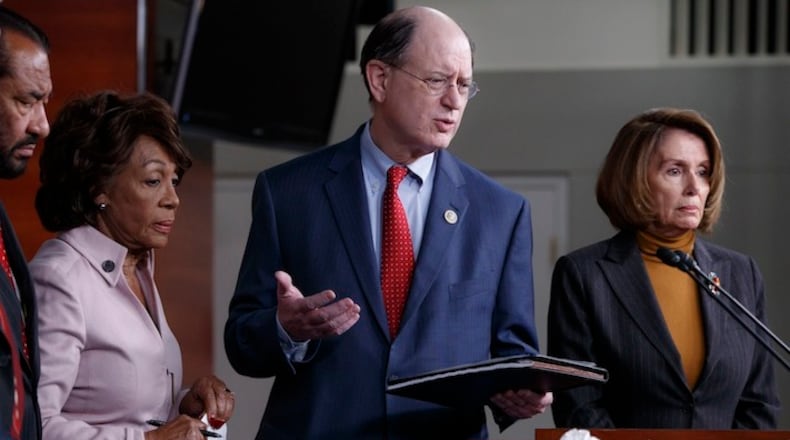 Members of the House Financial Services Committee, from left, Rep. Al Green, D-Texas, Rep. Maxine Waters, D-Calif., Rep. Brad Sherman, D-Calif., join House Minority Leader Nancy Pelosi of Calif. during a news on Capitol Hill in Washington, Monday, Feb. 6, 2017, to criticize President Donald Trump's pro-Wall Street policies. (AP Photo/J. Scott Applewhite)