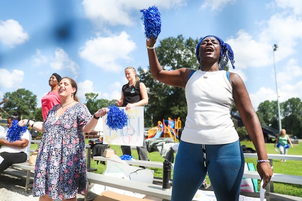 Supporters cheer during the first day of the  kickball game Friday. (Abbey Cutrer / AJC)