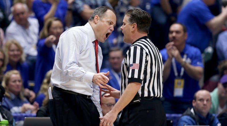 Georgia basketball coach Mark Fox can be animated with officials, but he seemed passive when an Auburn player joined his huddle during the late stages of Thursday night's game at Auburn.