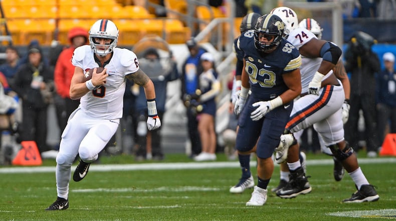 PITTSBURGH, PA - OCTOBER 28: Kurt Benkert #6 of the Virginia Cavaliers carries the ball for a 10 yard gain in the first quarter during the game against the Pittsburgh Panthers at Heinz Field on October 28, 2017 in Pittsburgh, Pennsylvania. (Photo by Justin Berl/Getty Images)