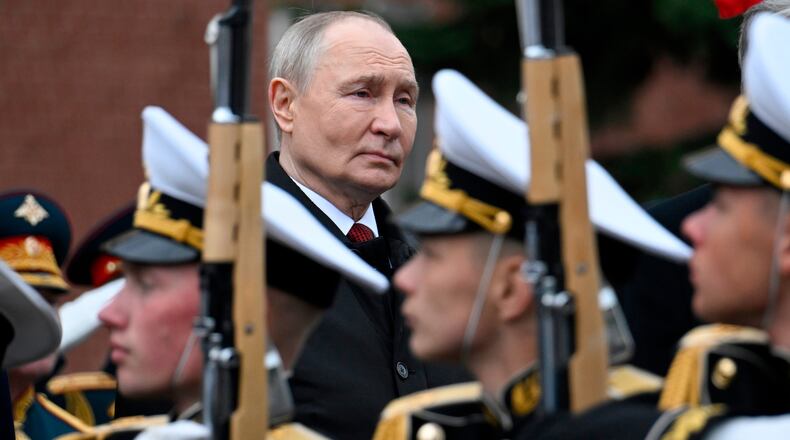 FILE - Russian President Vladimir Putin, rear center, attends a ceremony to lay flowers at the Tomb of the Unknown Soldier by the Kremlin wall in Moscow, Saturday, May 9, 2026, during celebrations of the 81st anniversary of the Soviet Union's victory over Nazi Germany during the World War II. (Alexander Nemenov/Pool Photo via AP, File)