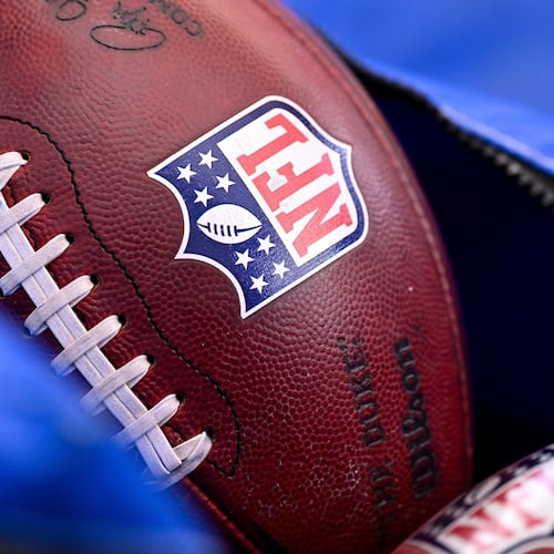 FILE - A detail view of the NFL shield on a football prior to an NFL football game between the Houston Texans and the Indianapolis Colts on Jan. 4, 2026, in Houston. (AP Photo/Maria Lysaker, File)