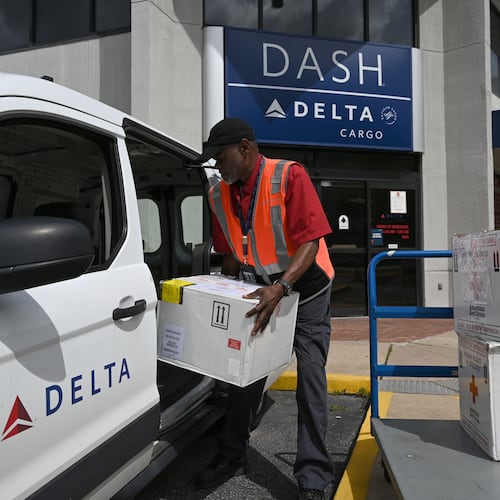 Kirkland Gibbs handles package drop-off at the Delta DASH office at Hartsfield-Jackson Atlanta International Airport on Thursday, May 28, 2026, in Atlanta. Delta DASH is Delta Air Lines’ same‑day express shipping service, providing fast air transport for time‑sensitive packages with priority handling across the airline’s domestic network. (Hyosub Shin/AJC)