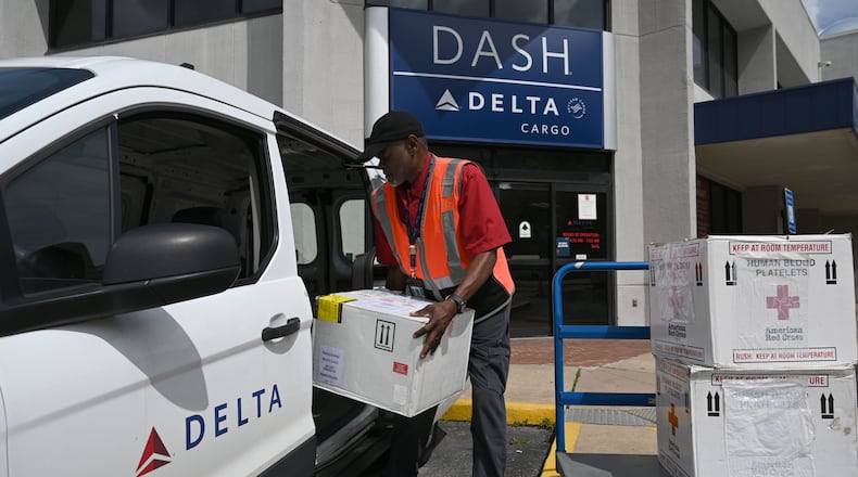 Kirkland Gibbs handles package drop-off at the Delta DASH office at Hartsfield-Jackson Atlanta International Airport on Thursday, May 28, 2026, in Atlanta. Delta DASH is Delta Air Lines’ same‑day express shipping service, providing fast air transport for time‑sensitive packages with priority handling across the airline’s domestic network. (Hyosub Shin/AJC)