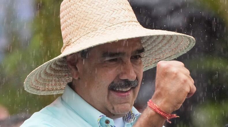 President Nicolas Maduro addresses supporters during a rally marking the anniversary of the Battle of Santa Ines, which took place during Venezuela's 19th-century Federal War, in Caracas, Venezuela, Wednesday, Dec. 10, 2025. (AP Photo/Ariana Cubillos)