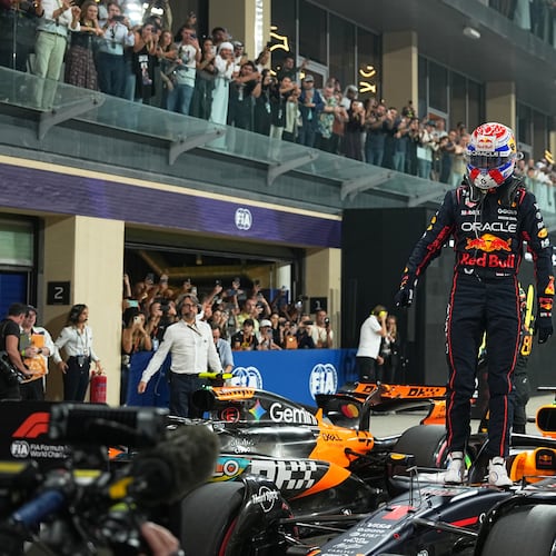 Red Bull driver Max Verstappen of the Netherlands celebrates after clocked the fastest time during the qualifying session ahead of the Formula One Abu Dhabi Grand Prix at the Yas Marina Circuit in Abu Dhabi, UAE, Saturday, Dec. 6, 2025. (AP Photo/Fatima Shbair)