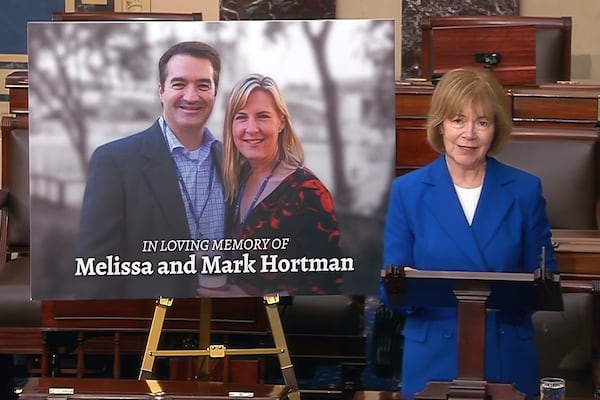 In this image from Senate Television video, Sen. Tina smith, D-Minn., speaks as a photo of Minnesota State Rep. Melissa Hortman and her husband Mark, is displayed on the Senate floor at the U.S. Capitol in Washington, Tuesday, June 17, 2025. (Senate Television via AP)
