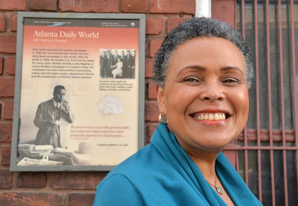 Alexis Scott stands outside the old abandoned Atlanta Daily World building on Auburn Avenue in Atlanta in March 2014. The newspaaer was sold in 2012  to out-of-town interests by the founding Scott family. HYOSUB SHIN / HSHIN@AJC.COM