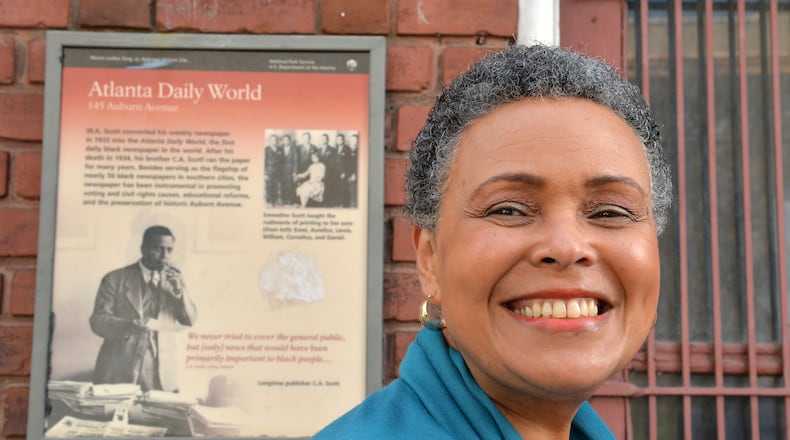 Alexis Scott stands outside the old abandoned Atlanta Daily World building on Auburn Avenue in Atlanta in March 2014. The newspaaer was sold two years ago to out-of-town interests by the founding Scott family. HYOSUB SHIN / HSHIN@AJC.COM