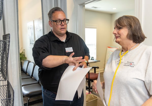 Executive Director Evan Shoemake and RNCeleste Frey work at Forsyth Community Clinic. Since opening two years ago, they've had more than 1,500 patient visits. (Phil Skinner for the AJC)