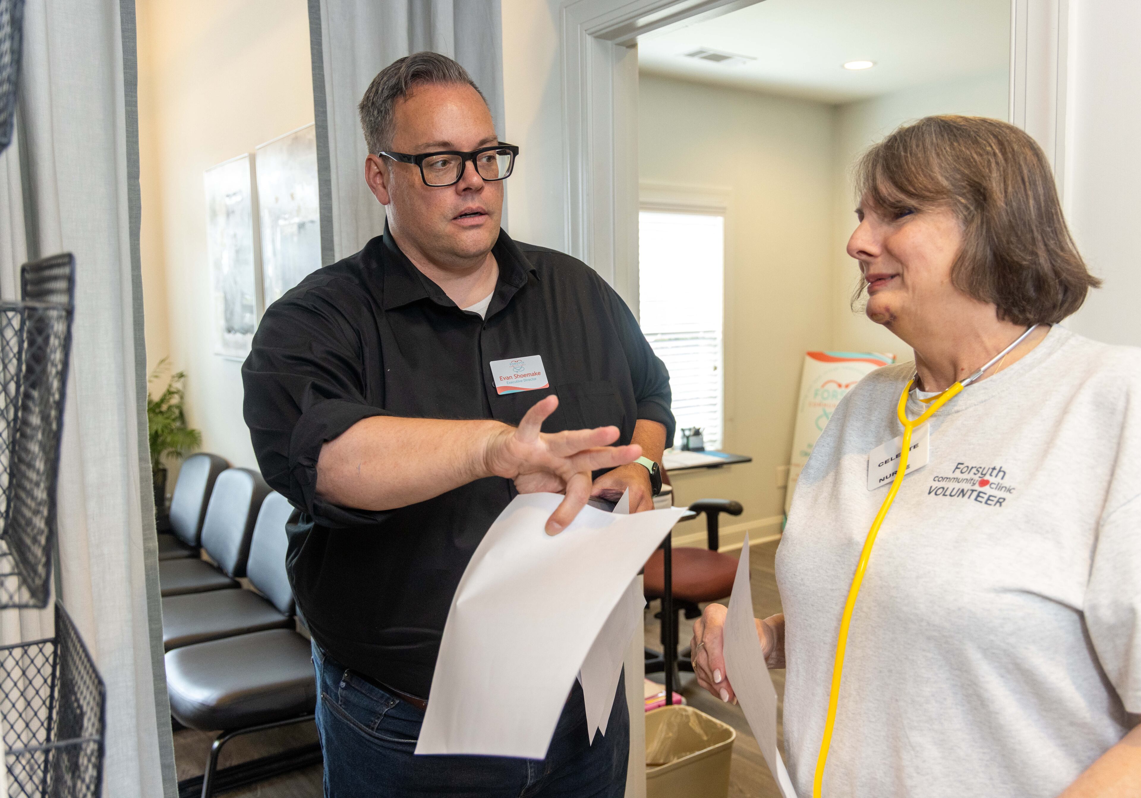 Executive Director Evan Shoemake and RNCeleste Frey work at Forsyth Community Clinic. Since opening two years ago, they've had more than 1,500 patient visits. (Phil Skinner for the AJC)