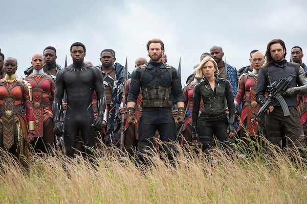 Stunt actor Taraja Ramsess, who died in a car crash on Oct. 31, 2023, stands just behind Scarlett Johansson, fifth from right, in a scene from Marvel’s 2018 film “Avengers: Infinity War.” (Chuck Zlotnick/Marvel Studios/Disney/TNS)
