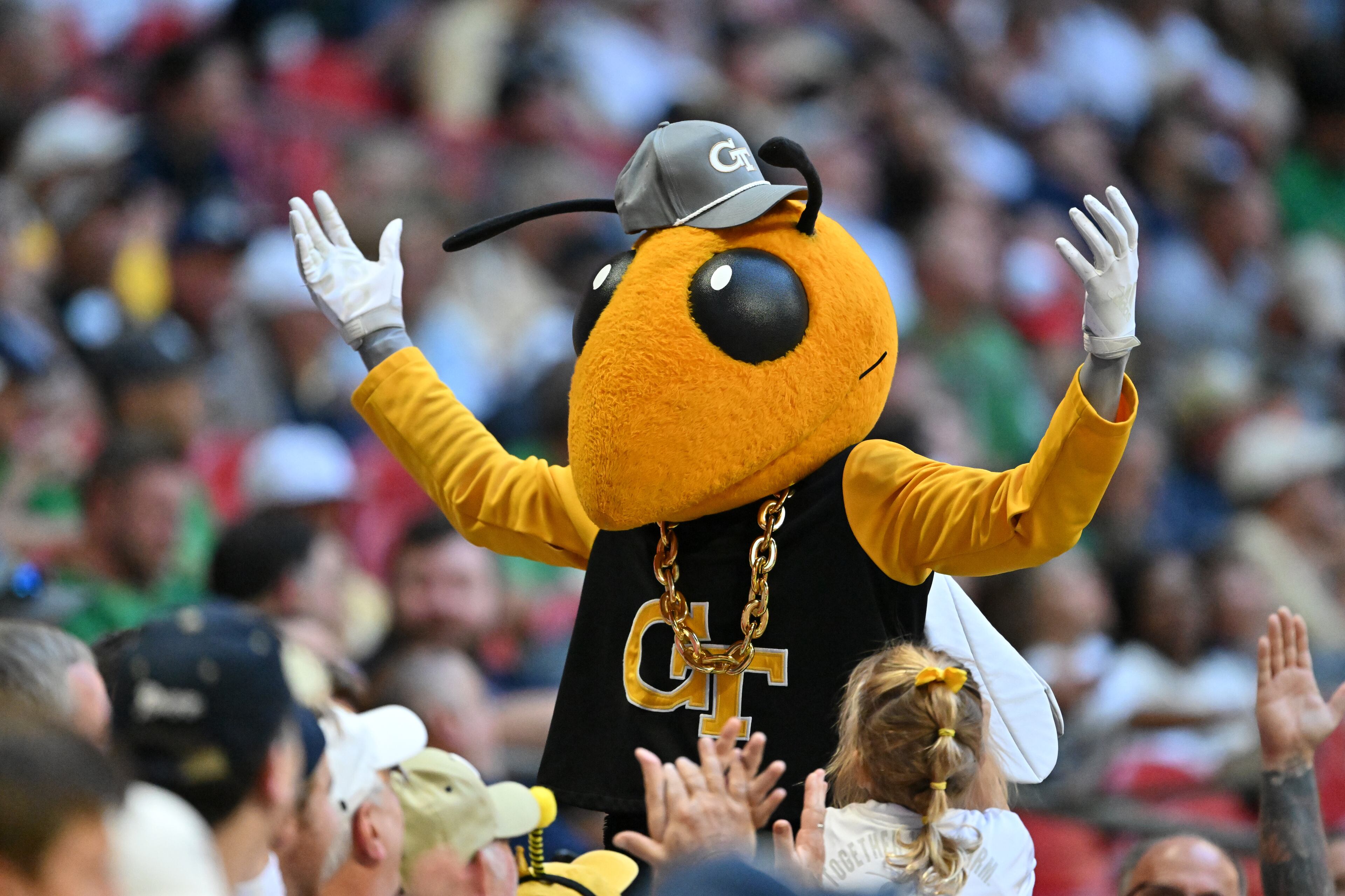 Georgia Tech mascot Buzz may have a pair of twin brothers to root on this fall, as East Coweta's Courtlin and Courtney Heard committed to play football for the Yellow Jackets. (Hyosub Shin/AJC 2024)