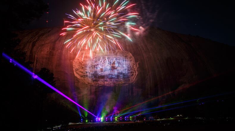 Fireworks explode during the laser show at Stone Mountain Park last April. Fireworks and the popular laser show will also be held for visitors during the Fourth of July celebration, which has been extended. STEVE SCHAEFER / SPECIAL TO THE AJC