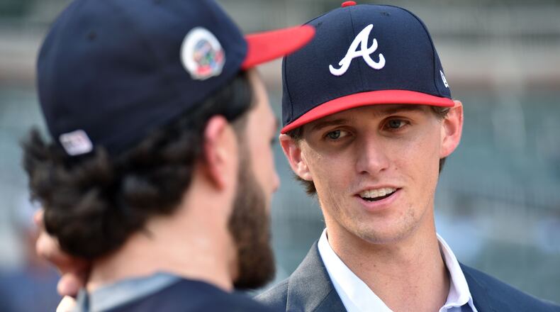 Kyle Wright is pictured talking with Braves shortstop and former Vanderbilt teammate Dansby Swanson after Wright signed with the Braves following the 2017 draft.  HYOSUB SHIN / HSHIN@AJC.COM